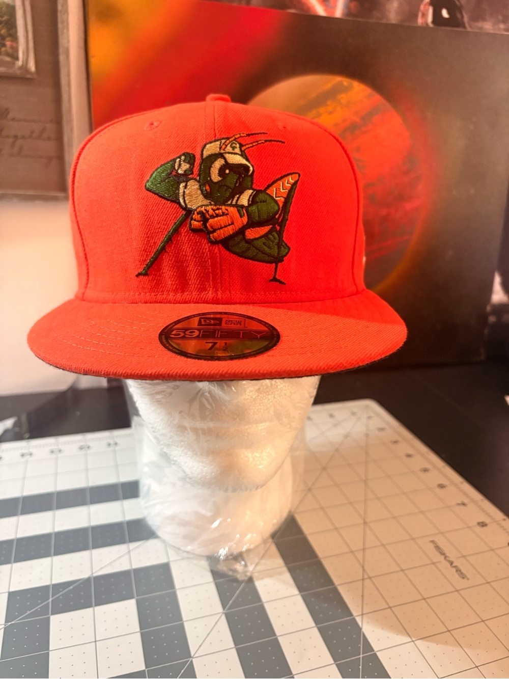 New Era Greensboro Grasshoppers mascot logo on the front.